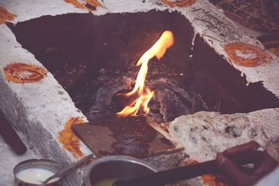 High angle view of fire on log