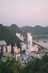 High angle view of buildings in city against clear sky