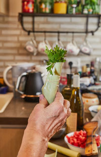 Cropped hand of woman holding food