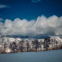 Scenic view of snowcapped mountains against sky