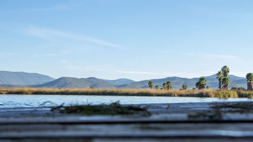 Surface level of lake against sky