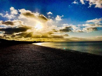 Scenic view of sea against sky at sunset