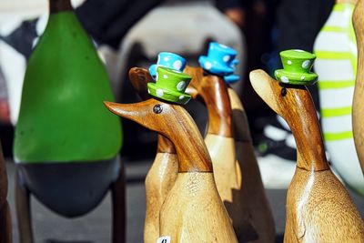 Funny wooden ducks with hats