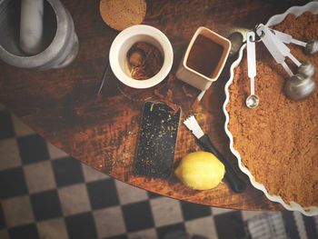 Directly above shot of ingredients with mobile phone on table