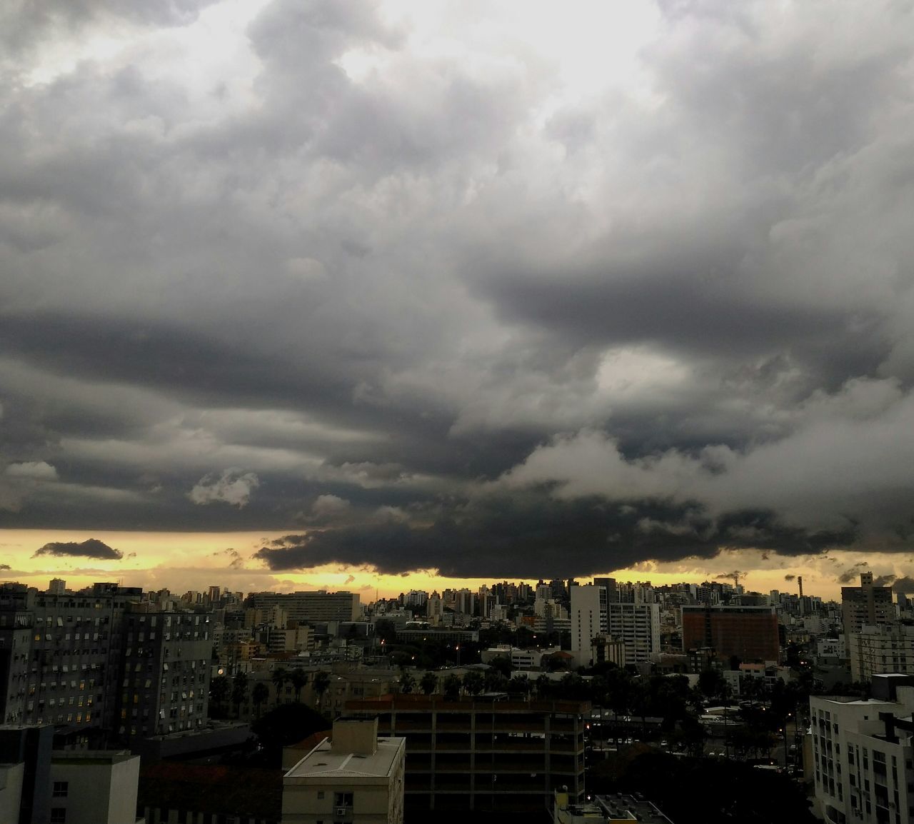 CITYSCAPE AGAINST STORM CLOUDS