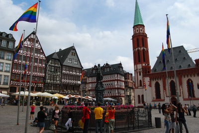 People against buildings in city