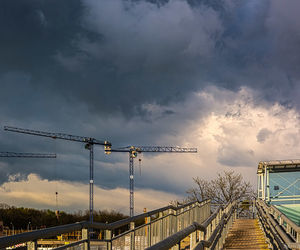 Low angle view of bridge against sky in city