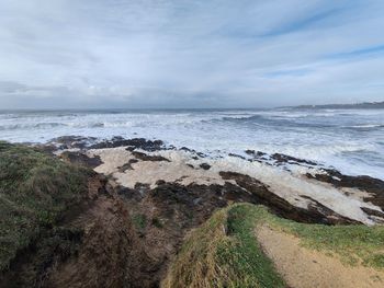 Scenic view of beach against sky