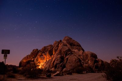 Scenic view of mountain against sky at night