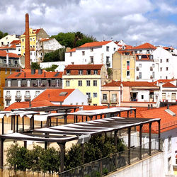 Houses in town against sky