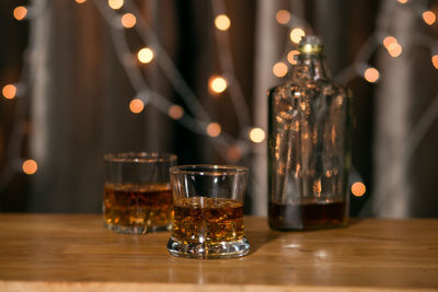Close-up of wine glasses on table