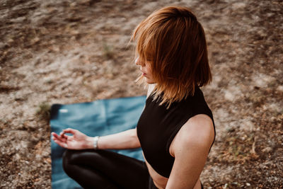 Woman meditating in park