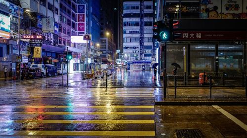 Wet illuminated city at night