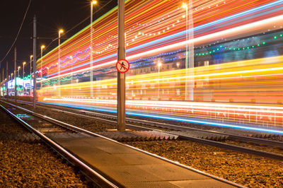 Light trails on railroad track at night