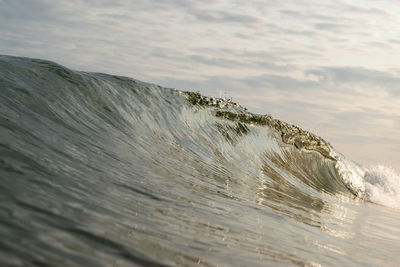 Scenic view of sea waves splashing on shore