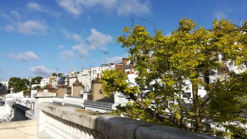 Buildings in town against sky