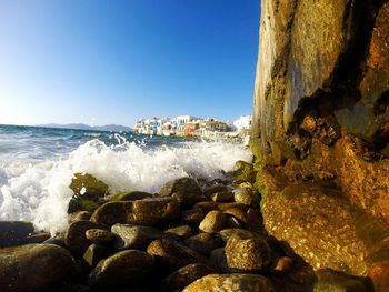 Scenic view of sea against clear blue sky