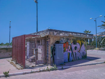 Graffiti on wall against clear sky