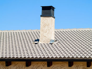 Low angle view of built structure against blue sky