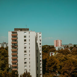 Low angle view of buildings against clear blue sky