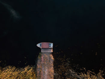 Abandoned tower on field against sky at night