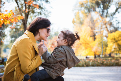 Woman with daughter at public park