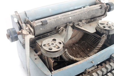 Close-up of vintage typewriter over white background