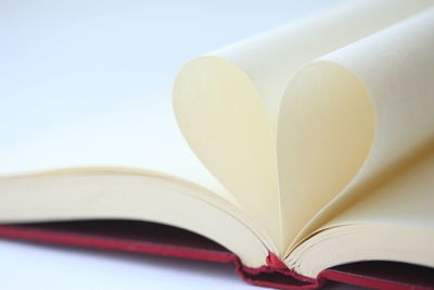 Close-up of pages forming heart shape
