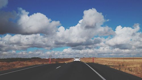 Empty road along landscape