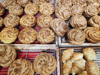 High angle view of sweet food on cooling racks in bakery