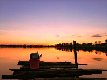 Scenic view of lake against sky during sunset