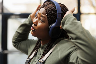 Side view of young woman looking away