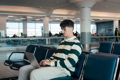 Side view of man sitting in bus