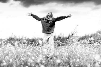 Full length of man standing on field against sky