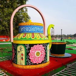 Close-up of text in park against sky
