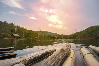 Scenic view of river against sky at sunset