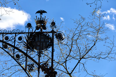 Low angle view of bare tree against sky