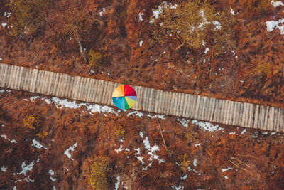 High angle view of multi colored umbrella on road
