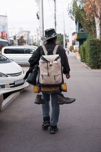 Rear view of man walking in city
