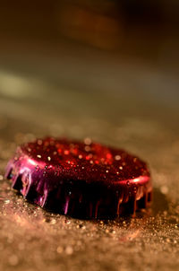 Close-up of bottle cap on table