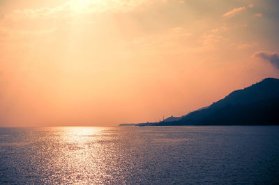 Scenic view of sea against sky during sunset