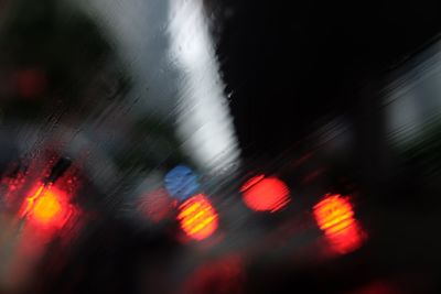 Defocused image of traffic on road at night