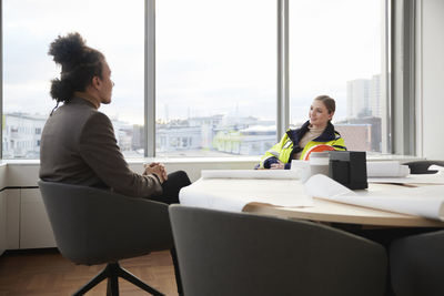 Smiling people having meeting in office