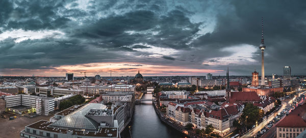 High angle view of buildings in city against sky during sunset