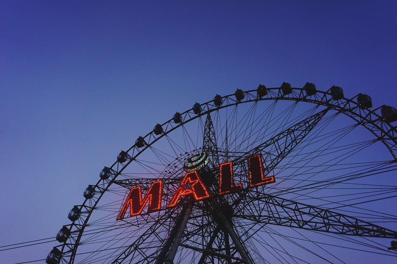 LOW ANGLE VIEW OF FERRIS WHEEL AGAINST SKY