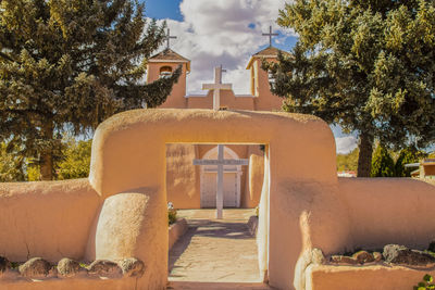 View of cemetery against buildings