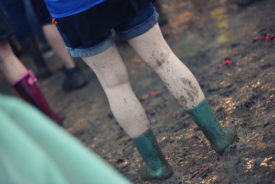 Low section of woman wearing shoes outdoors