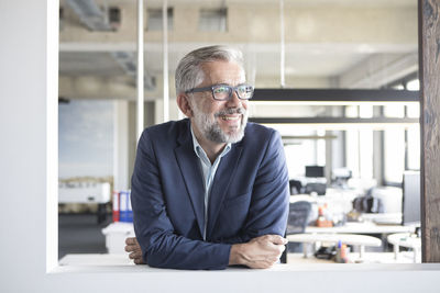 Smiling businessman in office