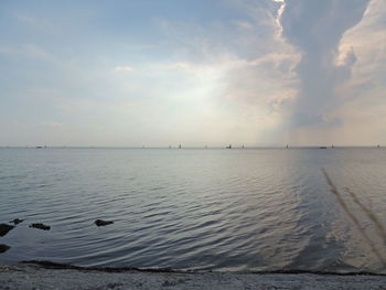 Scenic view of sea against sky at sunset