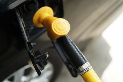 Refueling petrol into car gas tank.close up shot of petrol gun or nozzle fueling gas into car tank.